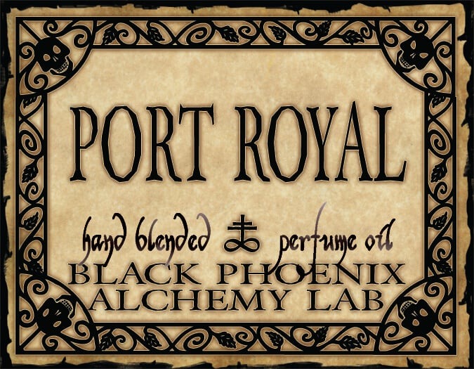 Label for 'Port Royal' hand blended perfume oil by Black Phoenix Alchemy Lab with decorative border.