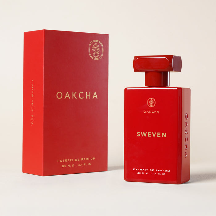 Front view of Sweven 100 ml perfume bottle and red box, glossy rectangular bottle with gold logo on pale background