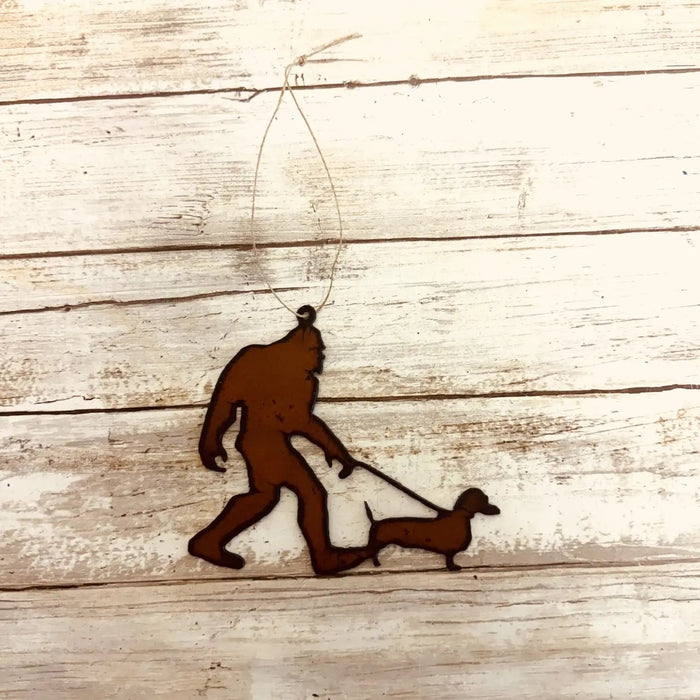 Universal Ironworks Bigfoot Yeti Sausage Dog Statue—funny dachshund decor, perfect unique gift for dog lovers and collectors.