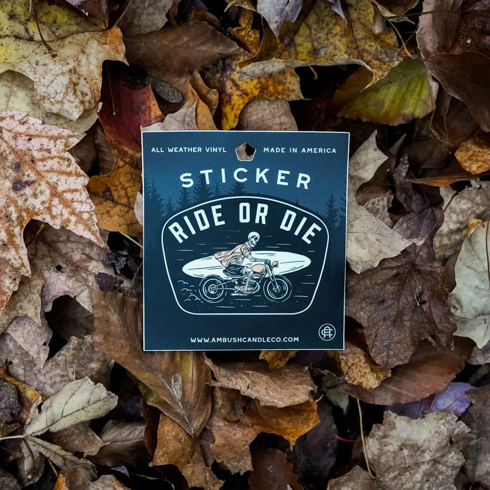 Forager Provisions LTD Ride or Die vinyl sticker featuring a skeleton riding a motorcycle with a surfboard on leaves.
