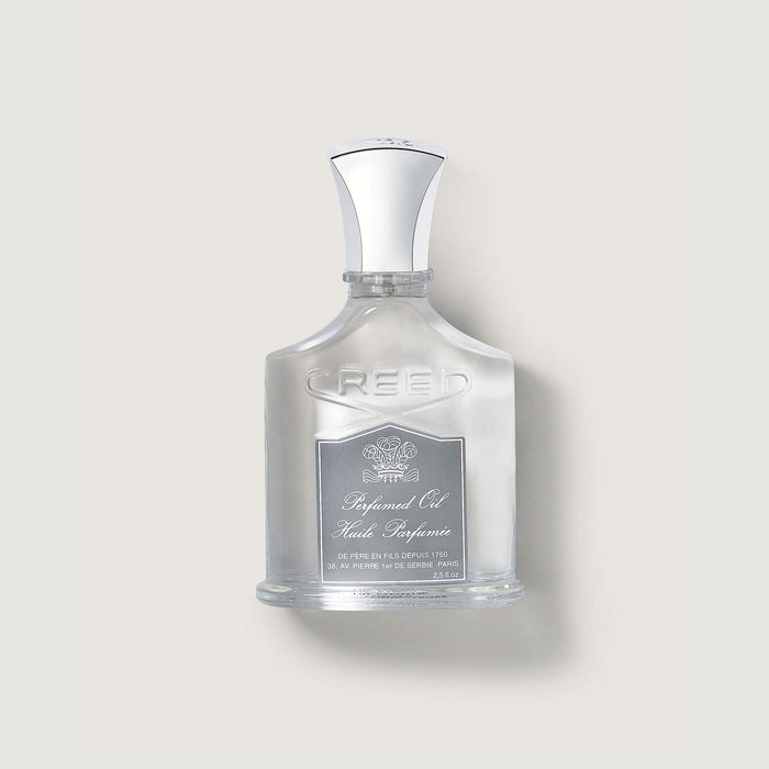 Creed Aventus Perfumed Body Oil bottle - Front View, silver cap, embossed glass | Creed Boutique