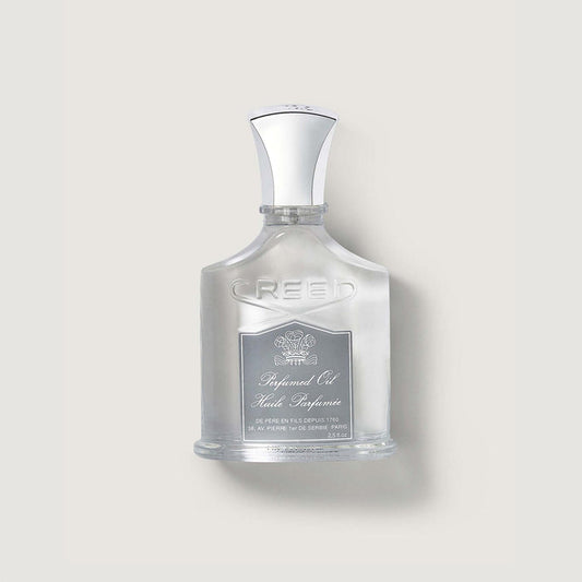 Creed Aventus Perfumed Body Oil bottle - Front View, silver cap, embossed glass | Creed Boutique