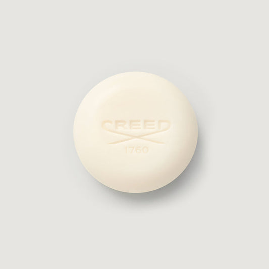 Cream-colored Carmina Perfumed Soap bar, embossed CREED 1760 logo, top view | Creed Boutique
