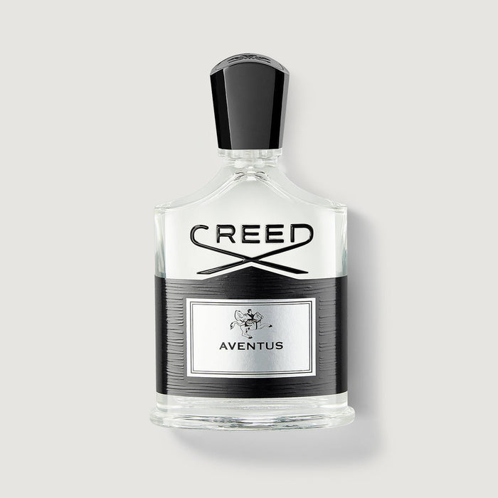 Creed Aventus 100ml cologne bottle, clear glass with black cap and label - Front View | Creed Boutique