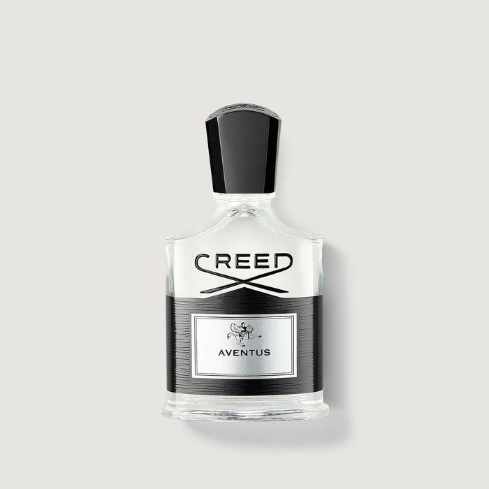Creed Aventus 50ml cologne bottle, clear glass with black cap and label - Front View | Creed Boutique