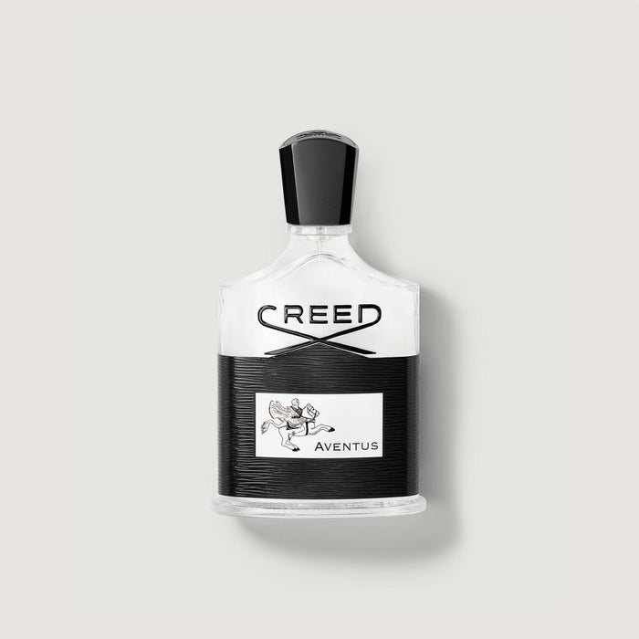 Creed Aventus 50ml/1.7oz cologne bottle, clear glass with black textured label - Front View | Creed Boutique