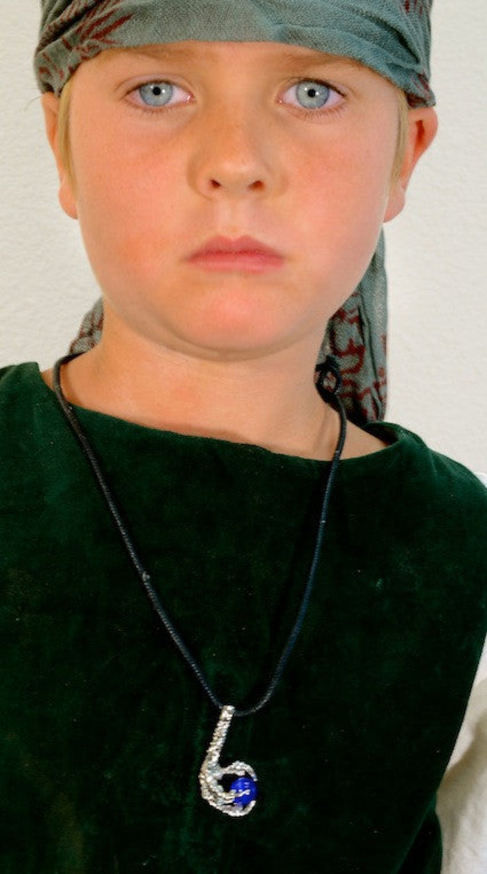 model wearing silver bird claw necklace with blue bead pendant on black cord