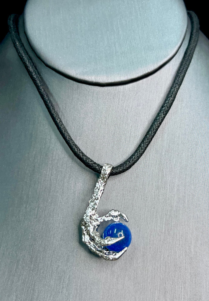 Close-up of Bird Claw Necklace Silver pendant detail