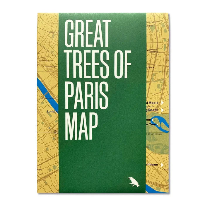 Cover of the Blue Crow Media Great Trees Of Paris Map, featuring a green band and a partial view of a yellow map in the background, printed on recycled paper.
