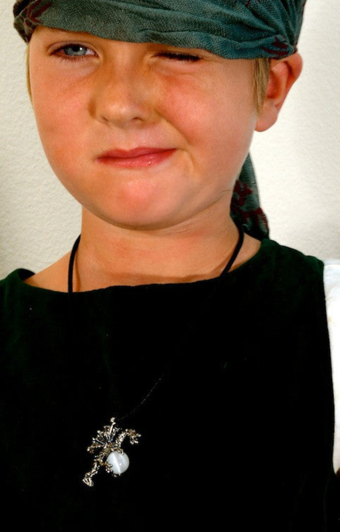 silver dragon necklace with gemstone pendant worn on model close up