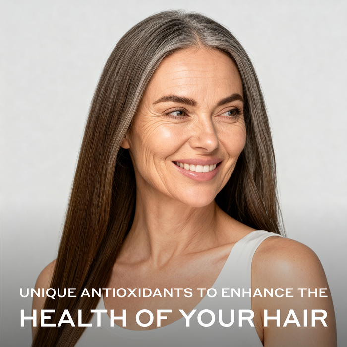 Woman with naturally graying hair and a healthy, luminous appearance representing the use of Zenagen Eclipse Color Preservation and Gray Support Conditioner.