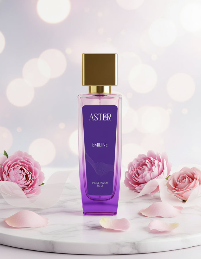 Perfume bottle labeled 'Aster Emilie' with pink roses on a light background