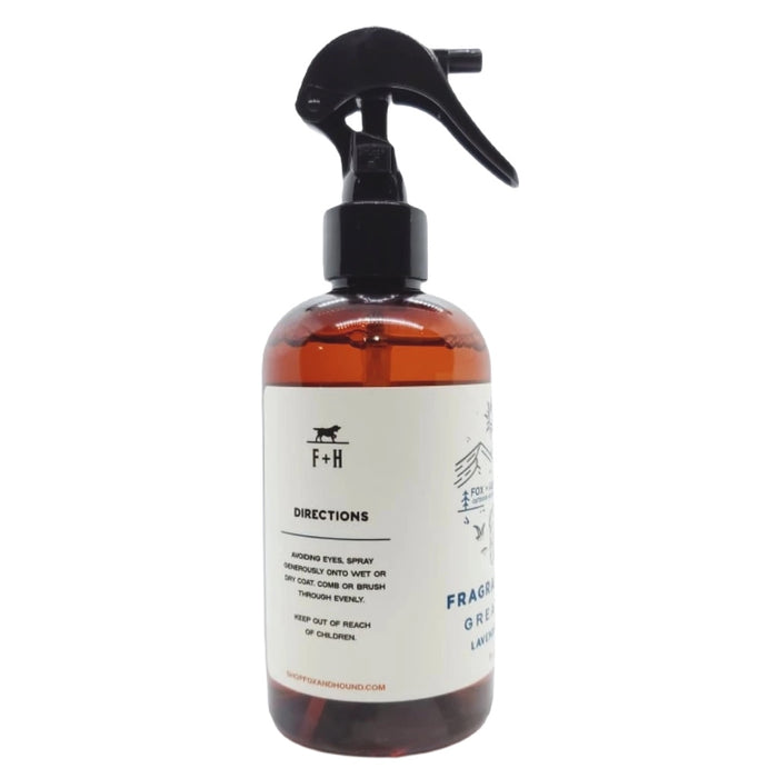 A brown bottle with a black spray nozzle labeled "Fox + Hound Dog Cologne - Acadia," perfect for doubling as dog cologne.