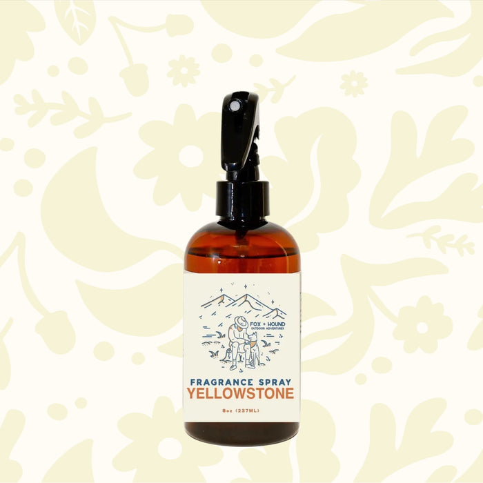 Forager Provisions LTD Fox + Hound Yellowstone dog cologne in an 8 oz amber spray bottle with mountain illustration.