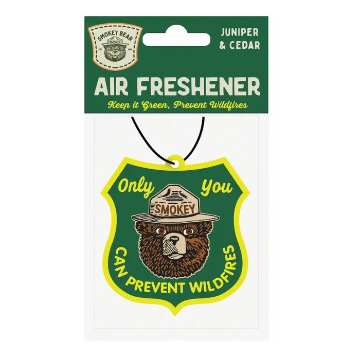 Juniper & Cedar Smokey Bear Air Freshener by Good & Well Supply Co in packaging with Only You Can Prevent Wildfires slogan.