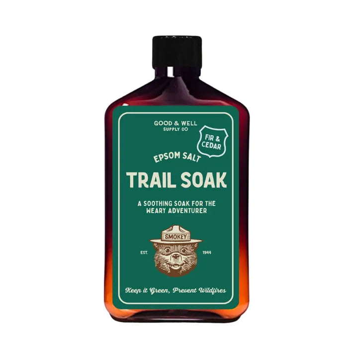Good & Well Supply Co Smokey Bear Trail Soak—fir, cedar bath soak with Smokey Bear label; natural, aromatic relaxation.