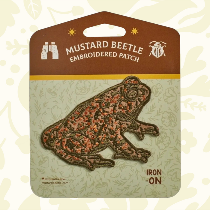 Forager Provisions LTD Mustard Beetle toad iron-on embroidered patch with earthy green and orange details on backing.