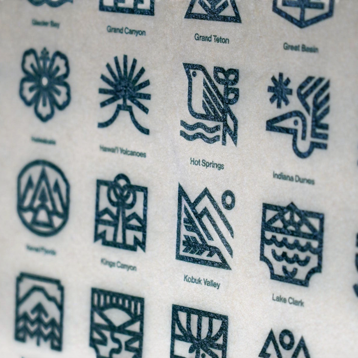 Forager Provisions LTD National Parks camp flag featuring a grid of screen-printed retro icons on wool felt.