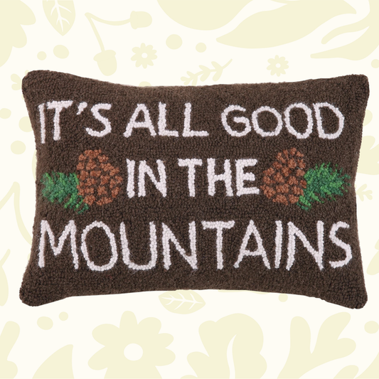 Forager Provisions LTD Peking Handicraft hooked wool cushion featuring a mountain slogan and pinecone design.