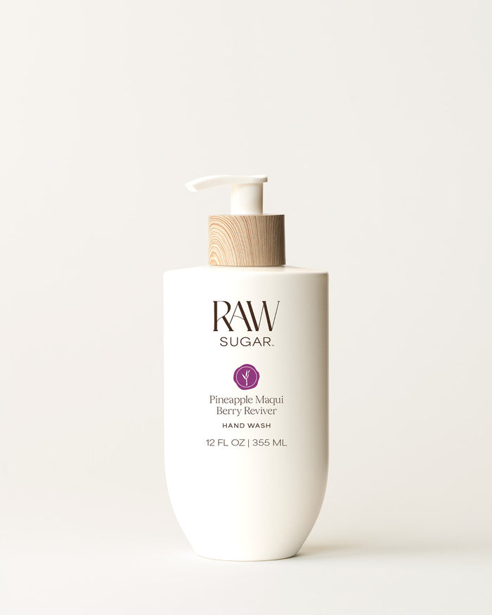 Bottle of Raw Sugar Pineapple Hand Wash on a cream background, designed to help gently cleanse hands with clean ingredients.