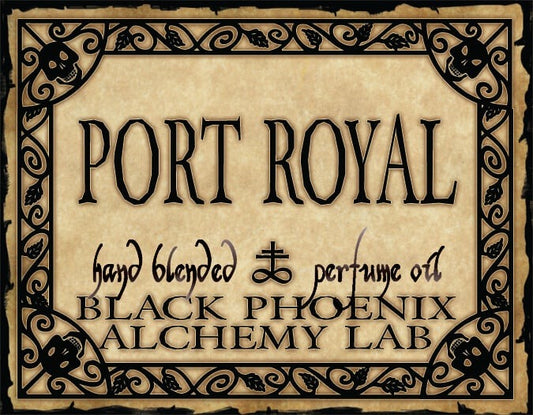 Label for 'Port Royal' hand blended perfume oil by Black Phoenix Alchemy Lab with decorative border.