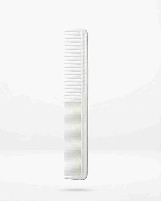White long hair comb with fine teeth, vertical close-up