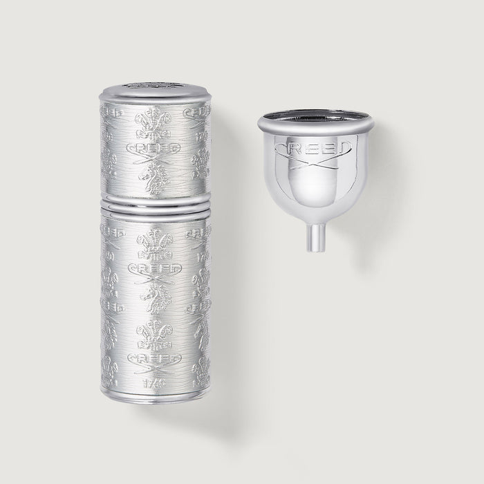 Silver 50ml Refillable Travel Perfume Atomizer with engraved Creed crest and refill funnel - Flat Lay | Creed Boutique
