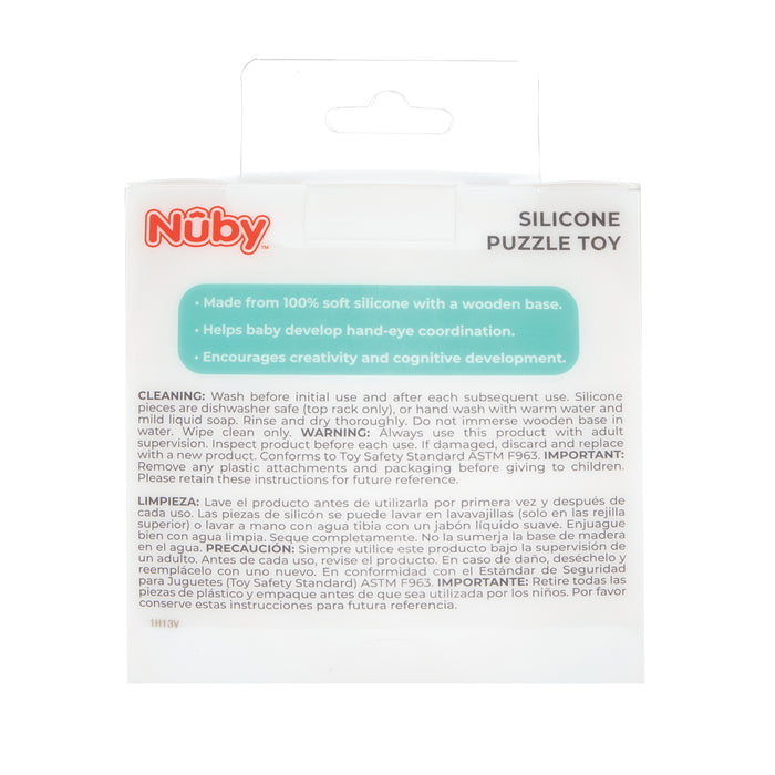 Back of a Silicone Puzzle Toy package shows product benefits, cleaning instructions, warnings, and info in English and Spanish on a white background. Hand-eye coordination and cognitive development are highlighted in a blue-green box.
