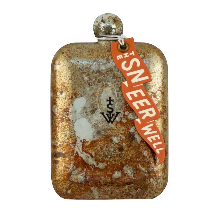 A rustic, rectangular flask with a worn, brown surface, marked with the letters "TSW," and a tag reading "THE SWELL" in orange. Featuring the Chief head emblem inspired by Native American culture, the Sneerwell Whiskey Flasks Chieftain makes an ideal Father's Day gift.