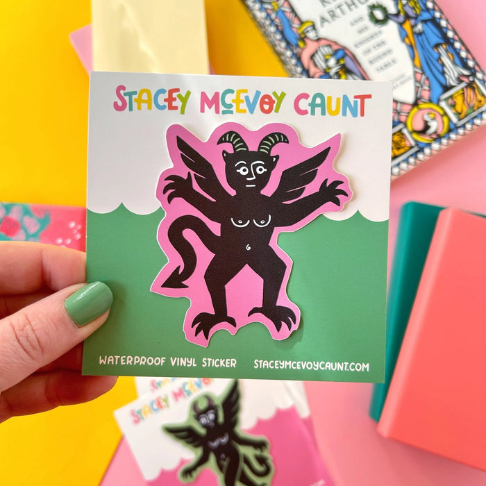 Forager Provisions LTD Stacey McEvoy Caunt pink devil medieval vinyl sticker on a backing card held by a hand