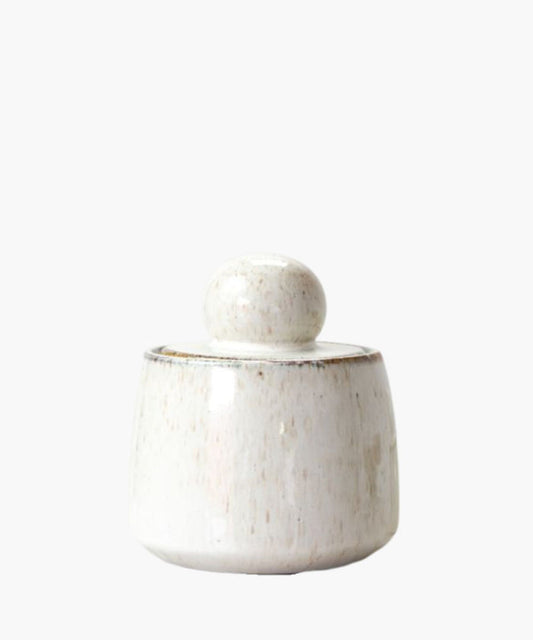 White ceramic jar with a lid on a white background. | SW Home