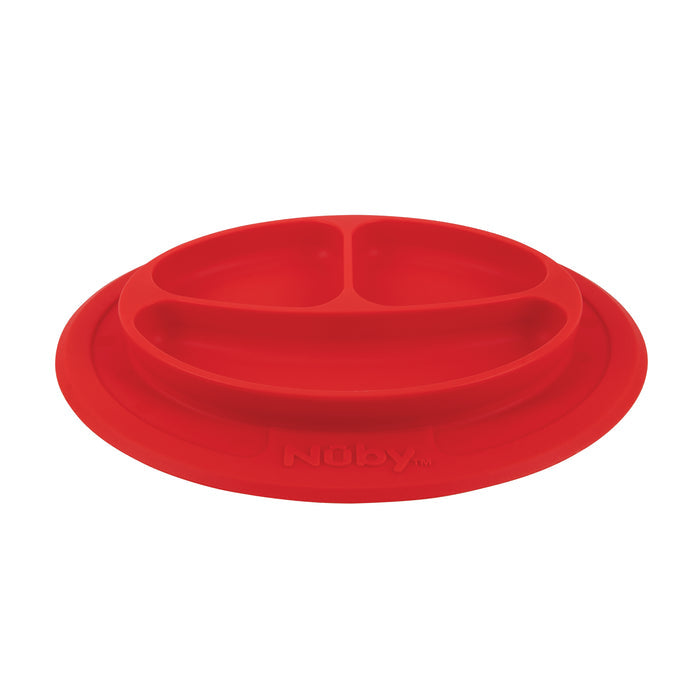 The Nuby Sure Grip Miracle Mat is a red, round silicone baby plate with three divided sections, a raised rim, strong suction base, and "Nuby" embossed on the front—perfect for self-feeding children.