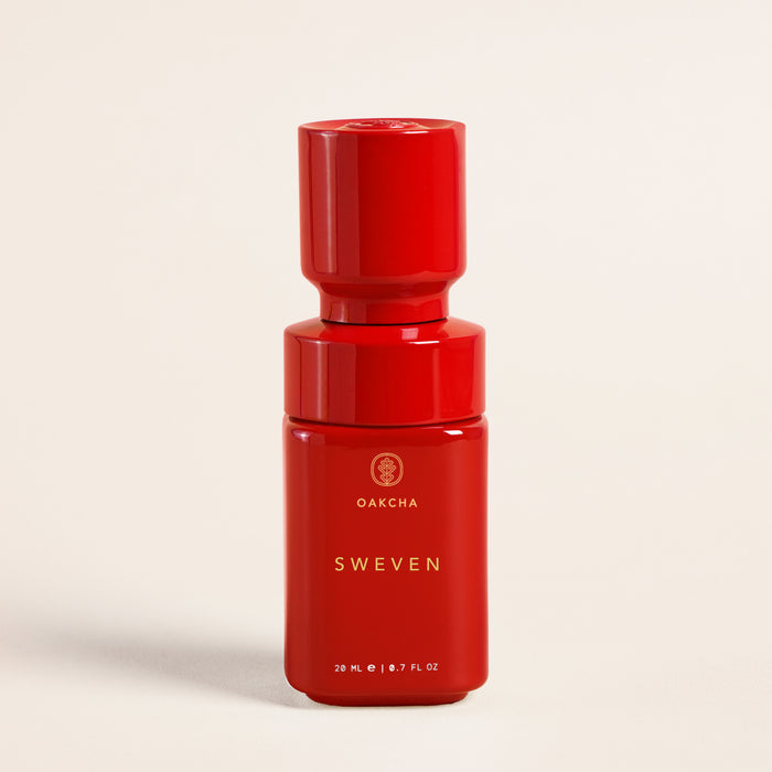 Front view of Sweven perfume oil bottle with glossy red finish, gold Oakcha logo and 20 ml labeling on cream background