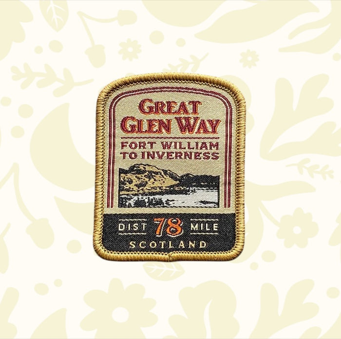Great Glen Way Patch by The Adventure Patch Company on wood, commemorates this iconic Scottish Highlands hiking trail badge.