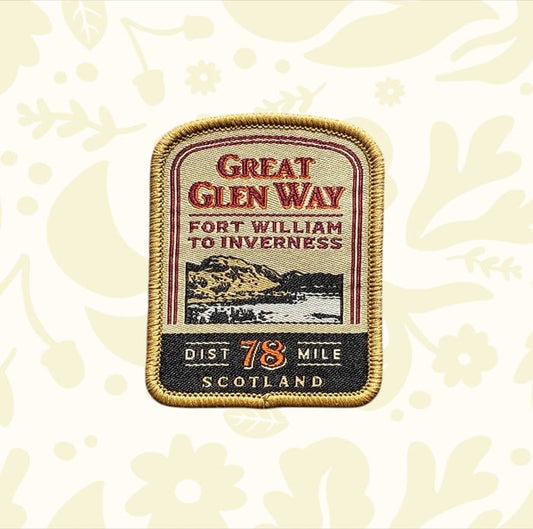 Great Glen Way Patch by The Adventure Patch Company on wood, commemorates this iconic Scottish Highlands hiking trail badge.