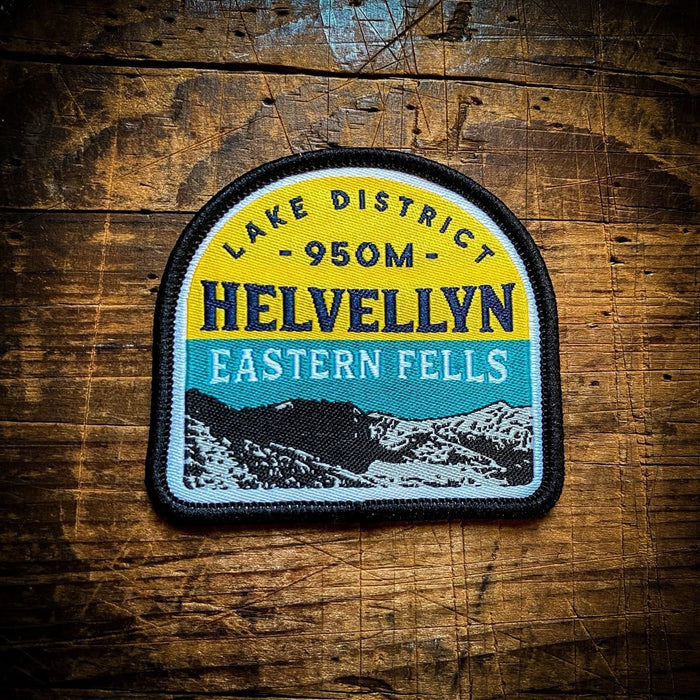 Forager Provisions LTD embroidered Helvellyn patch featuring Lake District mountain landscape on a wooden background