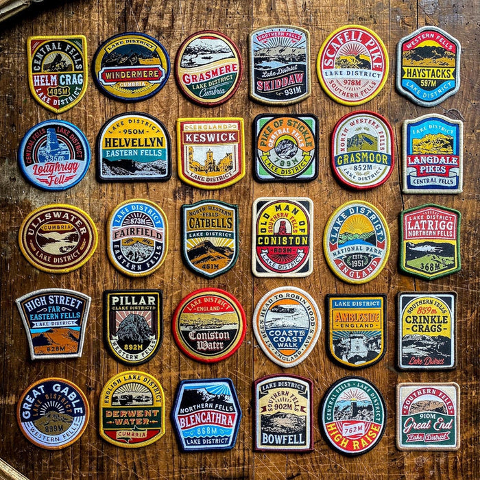 Colorful embroidered Scafell Pike patch by The Adventure Patch Company, Fells Series, displayed on wood, hiking souvenir.