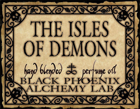 Label for 'The Isles of Demons' perfume oil by Black Phoenix Alchemy Lab with decorative border.