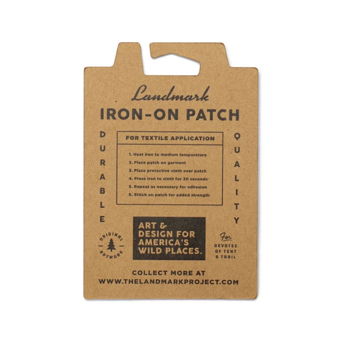 The Landmark Project Mount Rainier National Parks Patch features an illustration of Mount Rainier and trees, labeled "Mount Rainier Natl Park." It's perfect for outdoor adventures and is packaged sustainably.