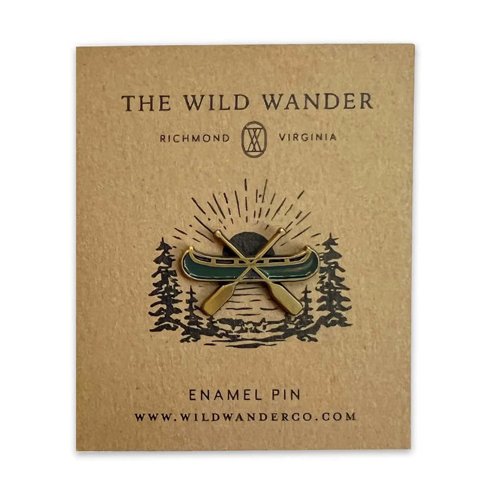 Forager Provisions LTD The Wild Wander canoe enamel pin with green and gold detailing on a branded backing card.
