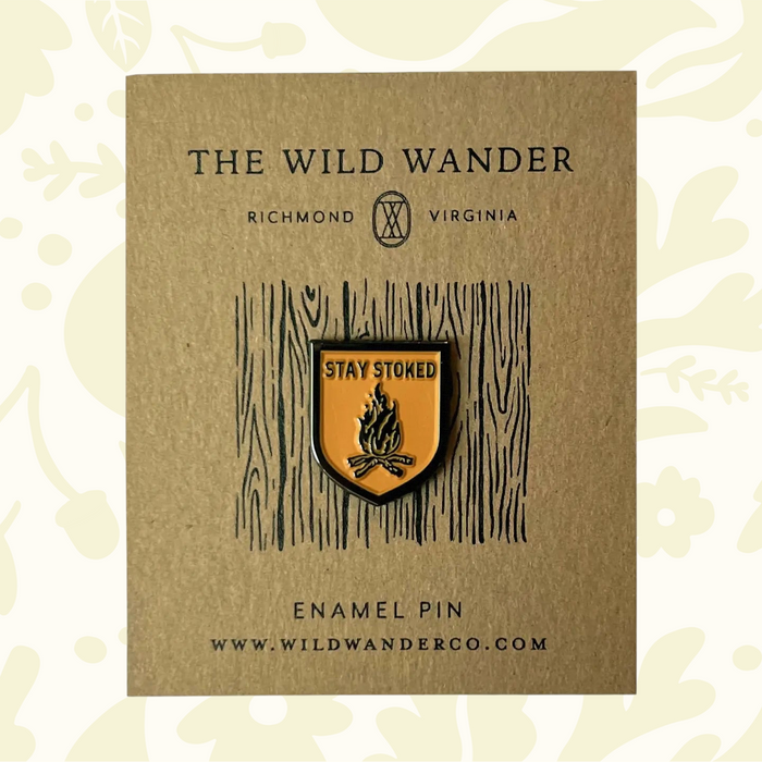 Forager Provisions LTD The Wild Wander Stay Stoked enamel pin featuring a campfire design on a gold-tone shield.