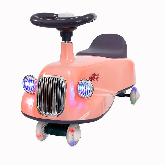 The Twist N' Ride Classic Car is a pink ride-on with dark purple seat and backrest, steering wheel, front grill, blue headlights, and light-up wheels. Its design resembles a classic vehicle for kids.
