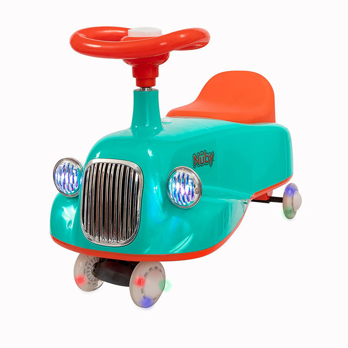 The Twist N' Ride Classic Car features a turquoise and orange design, large red steering wheel, chrome-like grill, headlights, four light-up wheels, and the Nuby brand printed on the side.