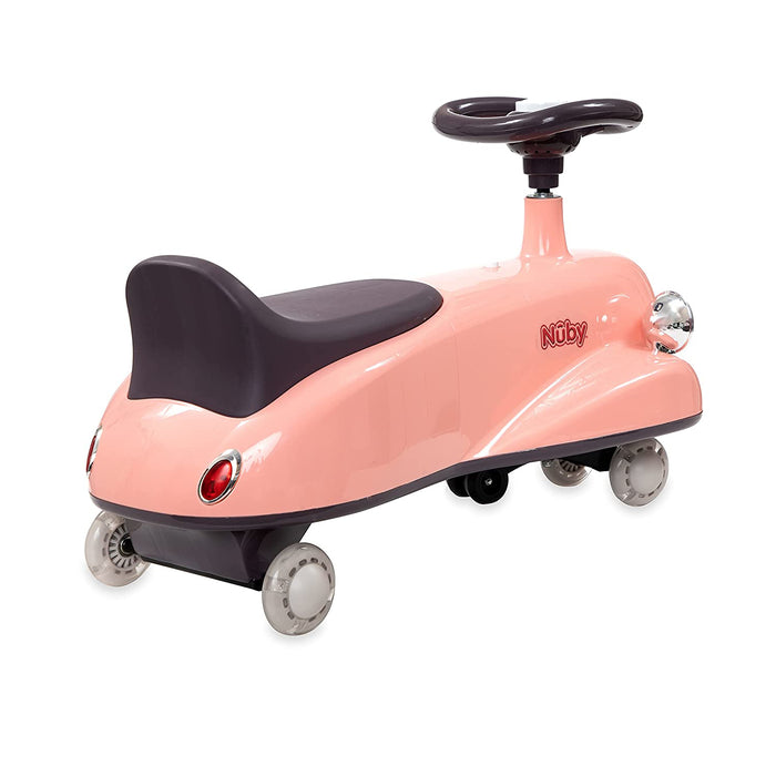 The Twist N' Ride Classic Car is a pink ride-on toy featuring a black seat and steering wheel, four small wheels with rear red reflector lights, and the Nuby logo on the side.