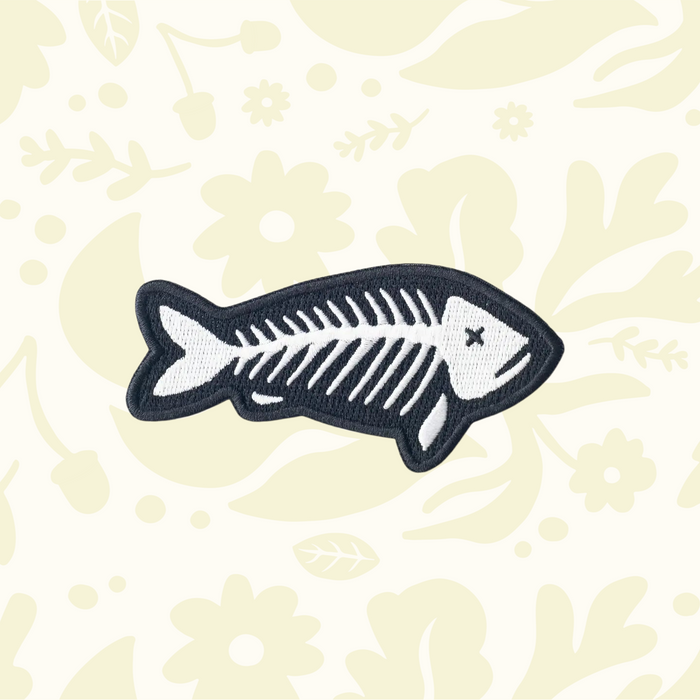 Forager Provisions LTD fish skeleton embroidered patch in black and white, suitable for iron-on or sew-on application.