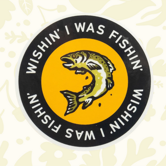Forager Provisions LTD round vinyl sticker featuring a jumping fish and the text Wishin I Was Fishin on a yellow background