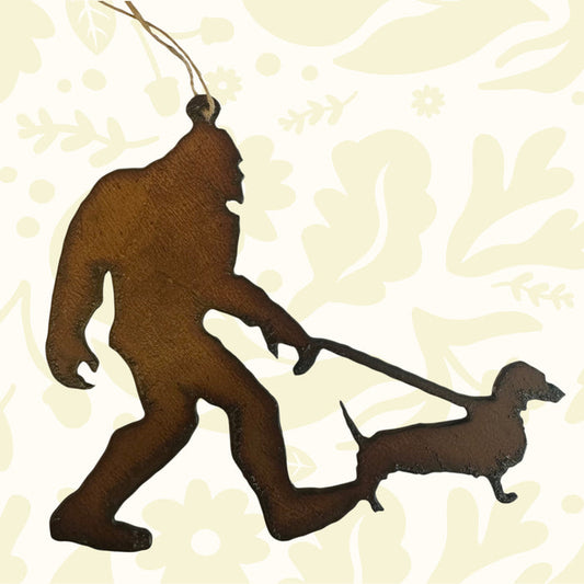 Universal Ironworks Bigfoot Yeti Sausage Dog Hanging Decoration—fun dachshund gift, quirky home accent with durable hanging string.