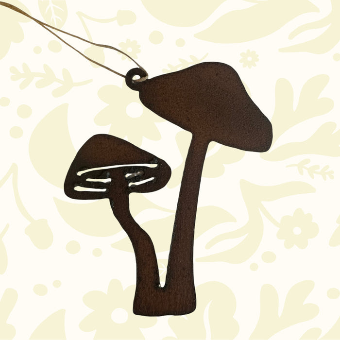 Universal Ironworks Double Tall Mushroom Hanging features two brown iron mushrooms on a string—unique rustic wall decor accent.