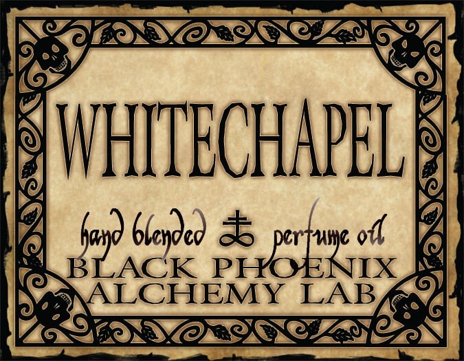 Label for 'Whitechapel' hand blended perfume oil by Black Phoenix Alchemy Lab with decorative border.