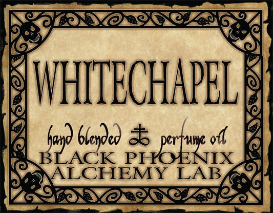 Label for 'Whitechapel' hand blended perfume oil by Black Phoenix Alchemy Lab with decorative border.